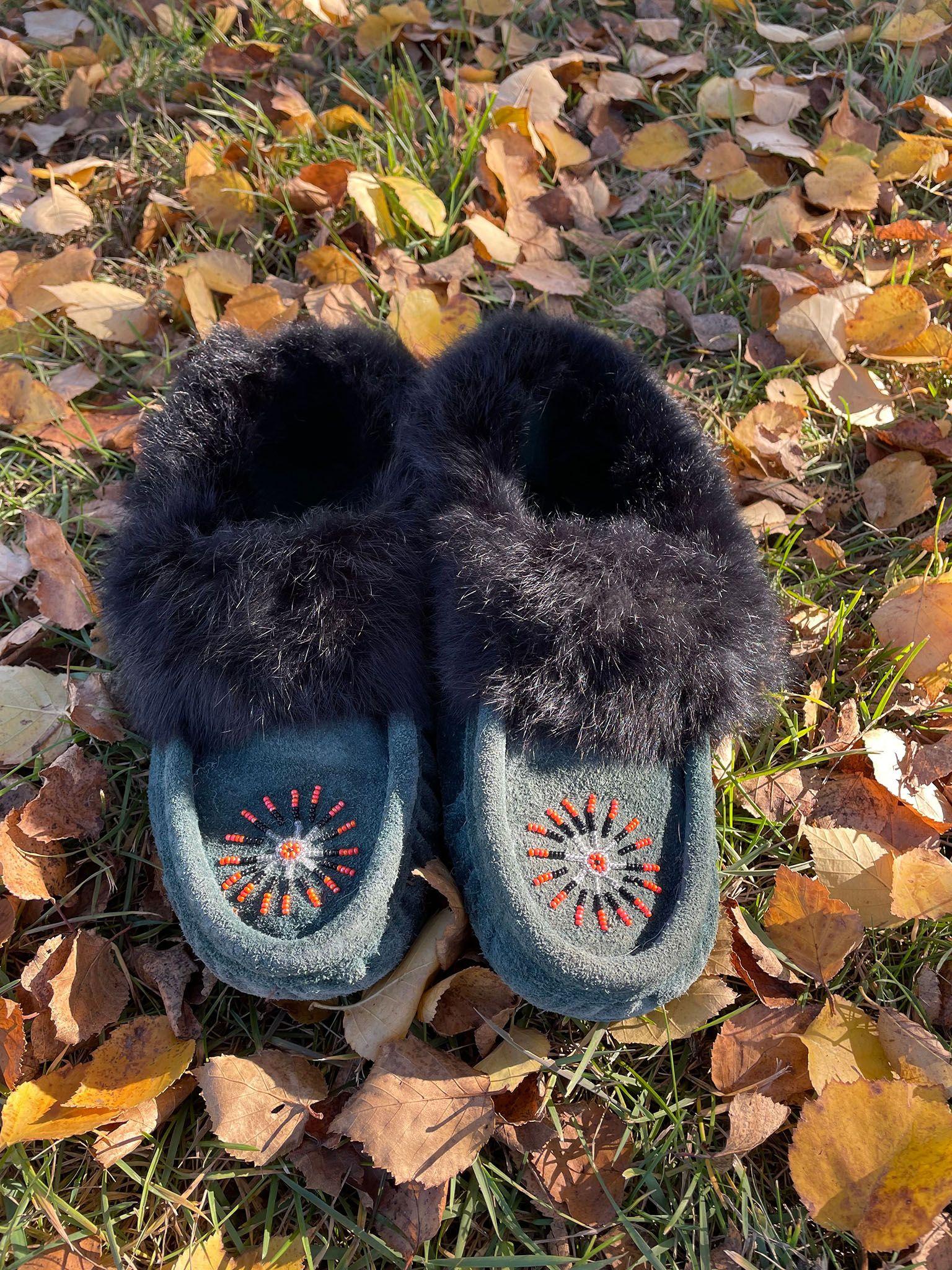 A pair of beaded moccasin